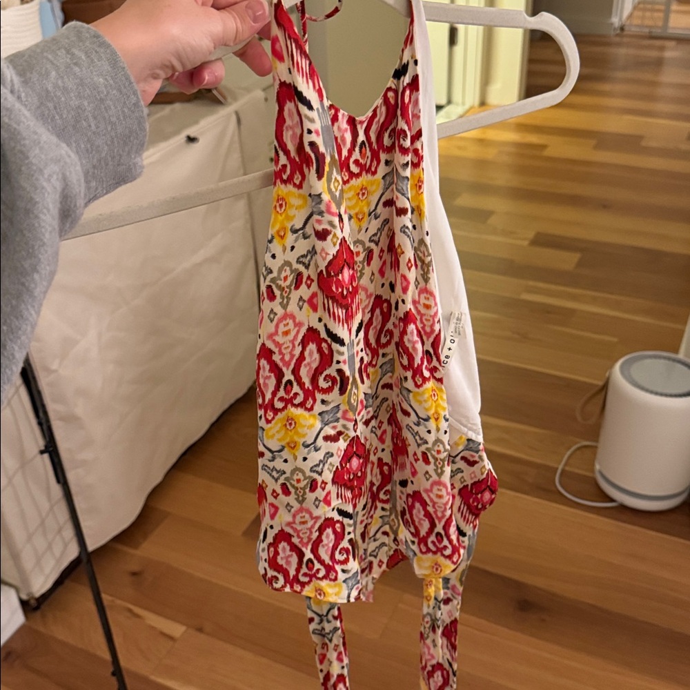 Silky halter top with open back and low tie